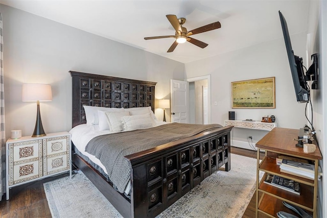 bedroom featuring dark hardwood / wood-style flooring and ceiling fan