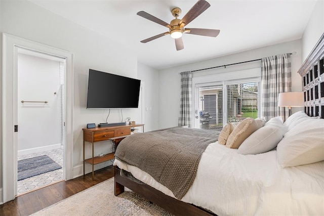 bedroom with ceiling fan and dark hardwood / wood-style floors