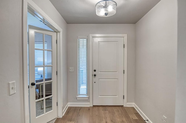 doorway featuring light hardwood / wood-style floors and plenty of natural light