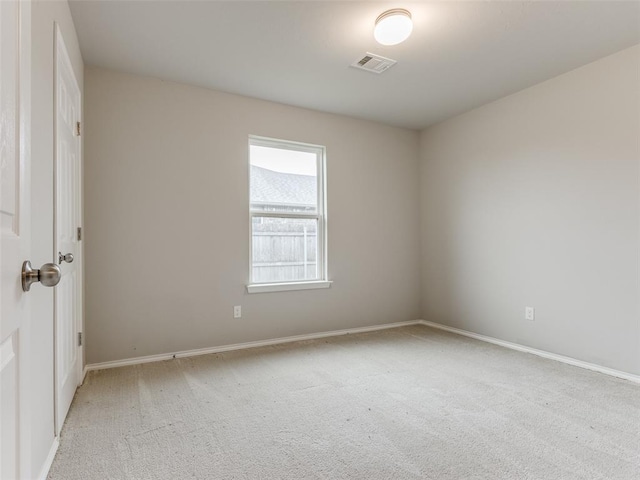 empty room with light colored carpet