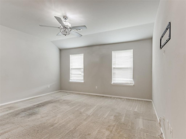 empty room featuring light carpet and ceiling fan