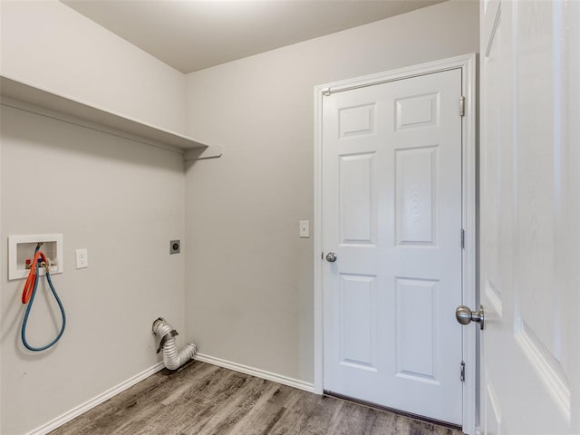 washroom with hookup for a washing machine, wood-type flooring, and hookup for an electric dryer