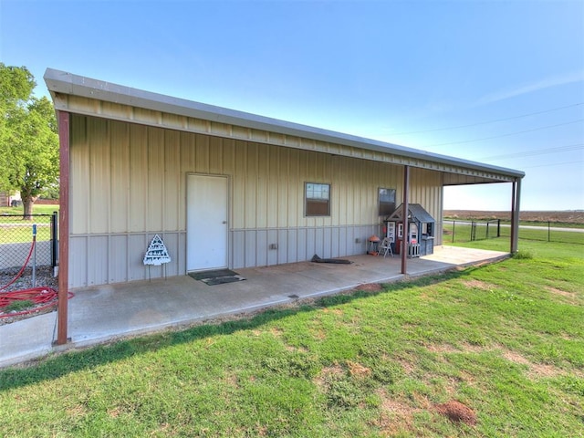 view of outbuilding with a lawn