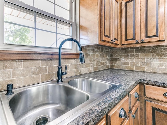 room details featuring backsplash and sink