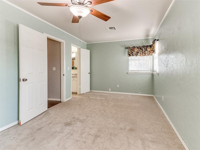 unfurnished bedroom featuring ceiling fan and crown molding