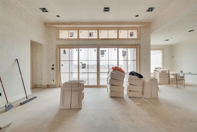 living room with a high ceiling