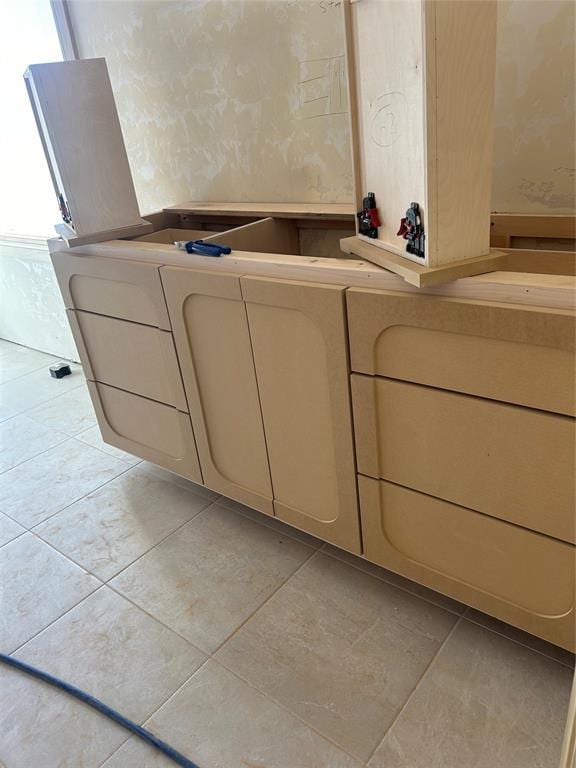 bathroom with tile patterned floors