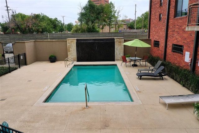 view of pool featuring a patio area