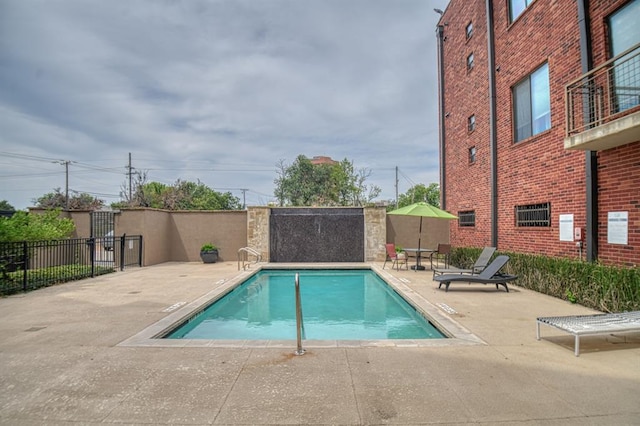 view of pool featuring a patio