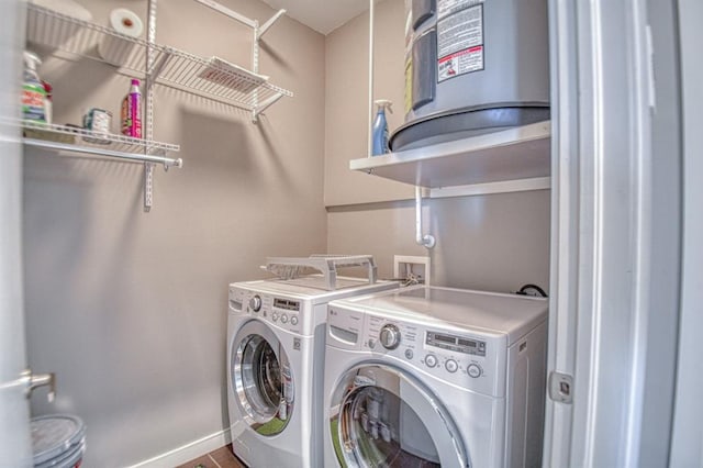 washroom with washing machine and clothes dryer