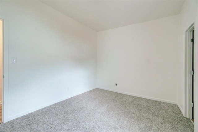 empty room with light colored carpet