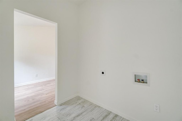 laundry room featuring hookup for a washing machine, light hardwood / wood-style floors, and electric dryer hookup