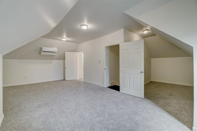 bonus room with carpet floors, an AC wall unit, and lofted ceiling