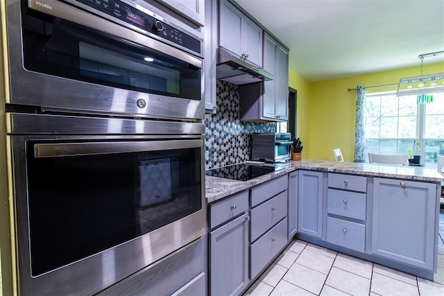 kitchen with tasteful backsplash, kitchen peninsula, gray cabinets, black electric stovetop, and light tile patterned flooring