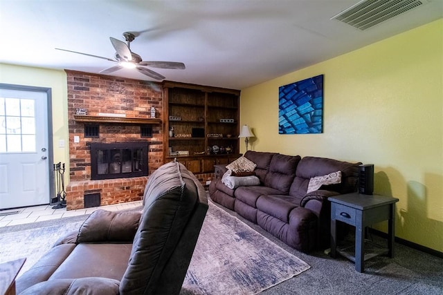 living room with ceiling fan, light colored carpet, and a fireplace