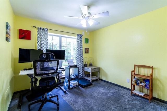 carpeted home office featuring ceiling fan