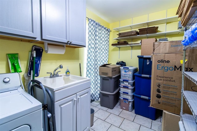 laundry room with cabinets and sink