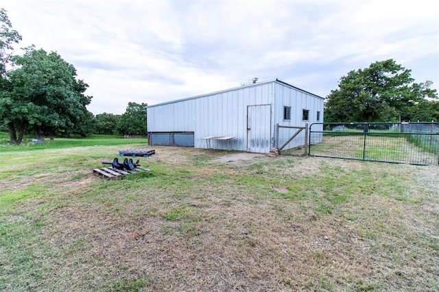 view of outbuilding with a lawn