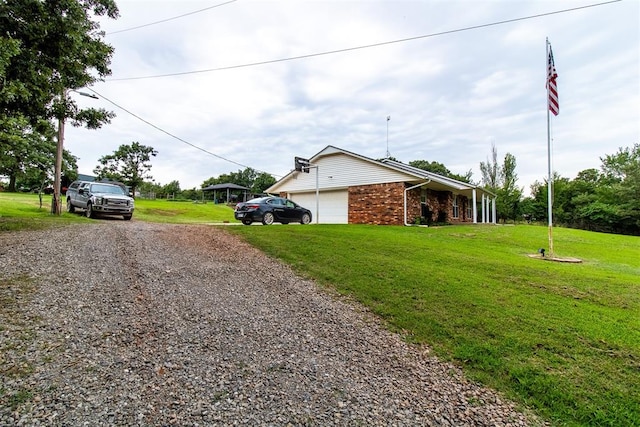 exterior space featuring a yard and a garage