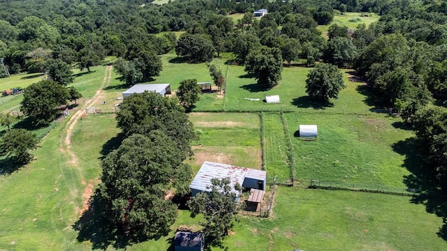 birds eye view of property with a rural view