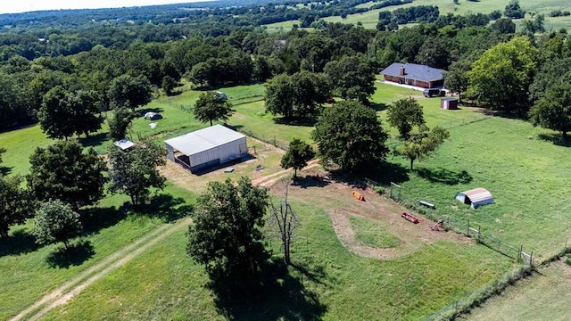 birds eye view of property with a rural view