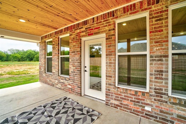 view of exterior entry featuring a porch