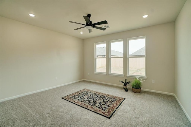 carpeted empty room with ceiling fan