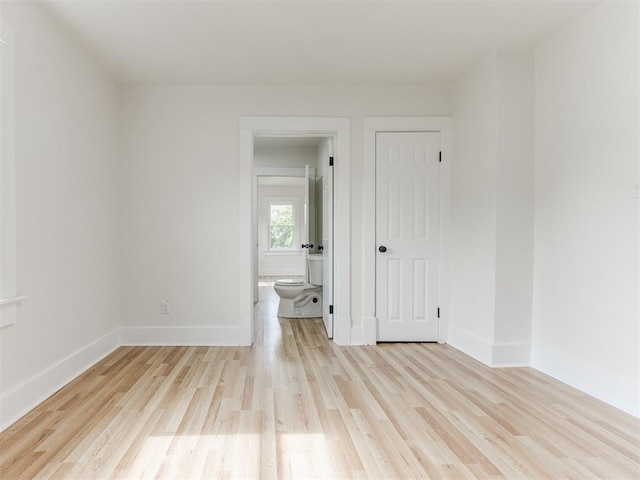 spare room with light wood-type flooring