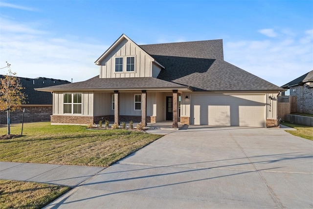 view of front facade with a front yard and a garage