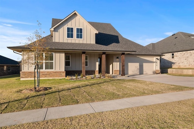 view of front of home with a front lawn, a porch, and a garage