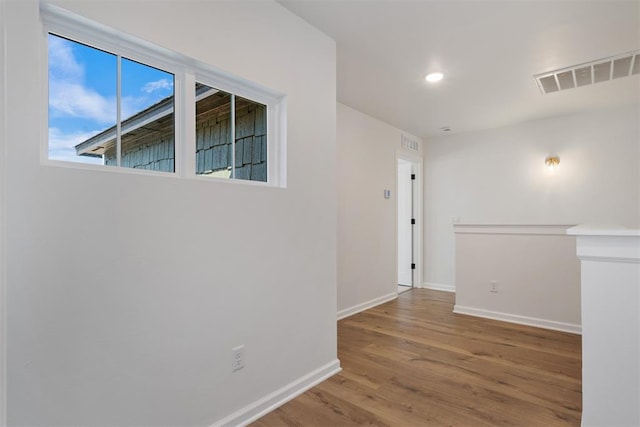 unfurnished room featuring wood-type flooring