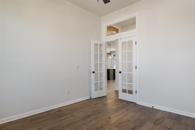 spare room with french doors, dark hardwood / wood-style flooring, and ceiling fan