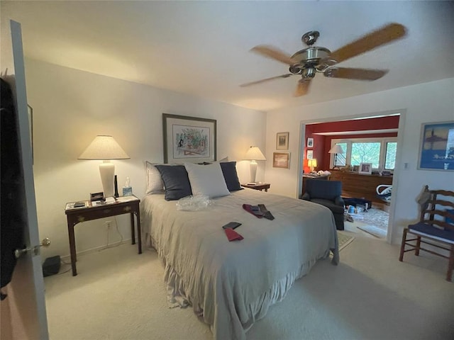 bedroom featuring ceiling fan and light colored carpet