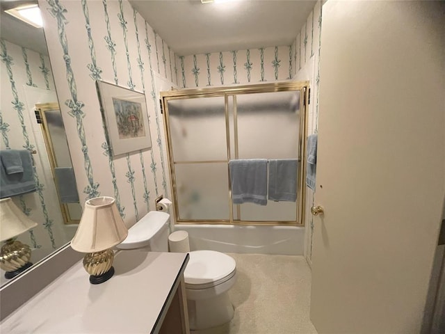 full bathroom with shower / bath combination with glass door, vanity, and toilet