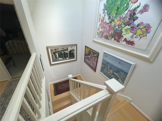 staircase featuring hardwood / wood-style floors