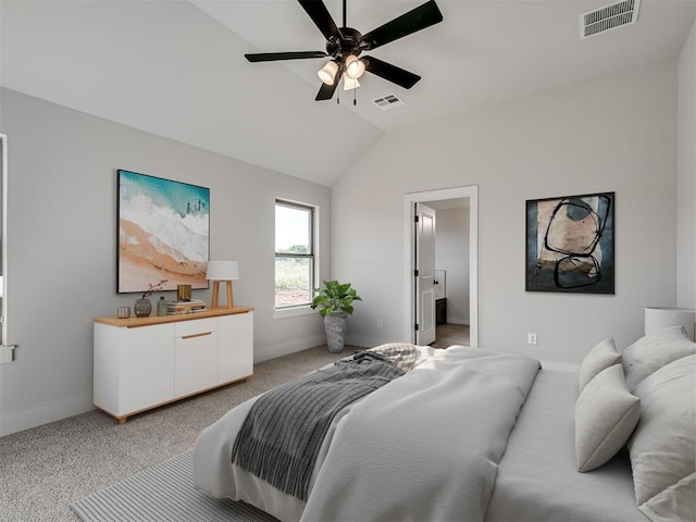 bedroom featuring connected bathroom, ceiling fan, light carpet, and vaulted ceiling