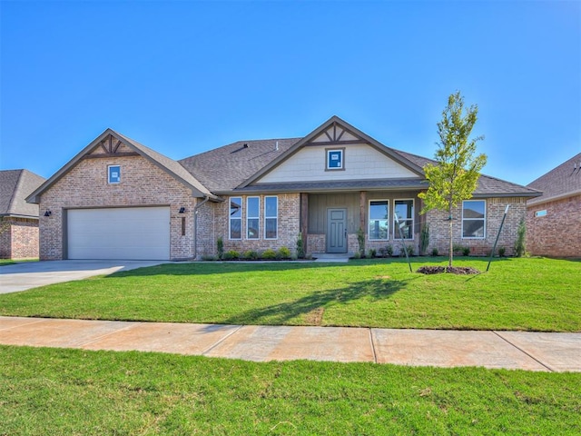 craftsman house with a front yard and a garage