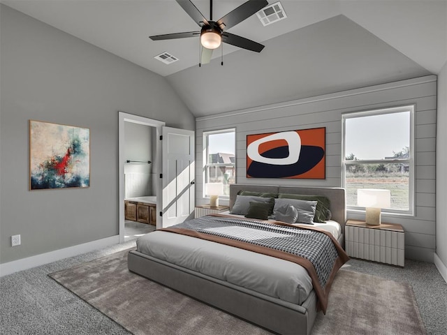 bedroom featuring carpet, ceiling fan, connected bathroom, and vaulted ceiling