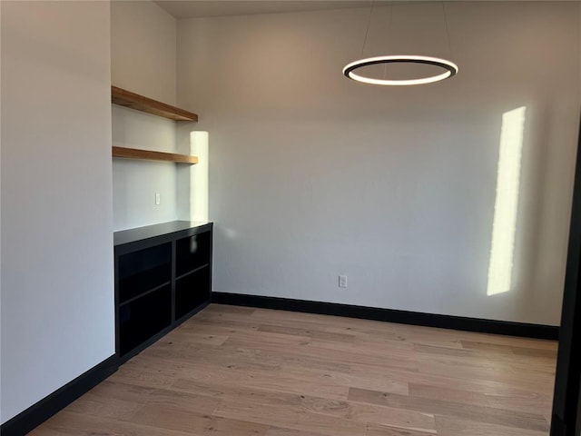 unfurnished room with light hardwood / wood-style floors