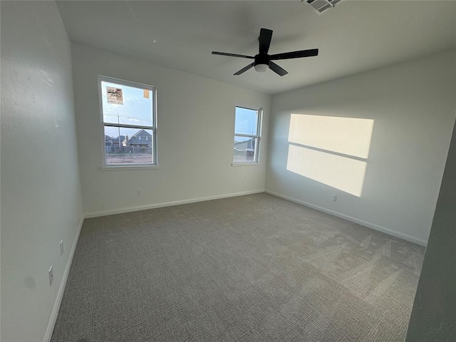 unfurnished room featuring carpet flooring and ceiling fan