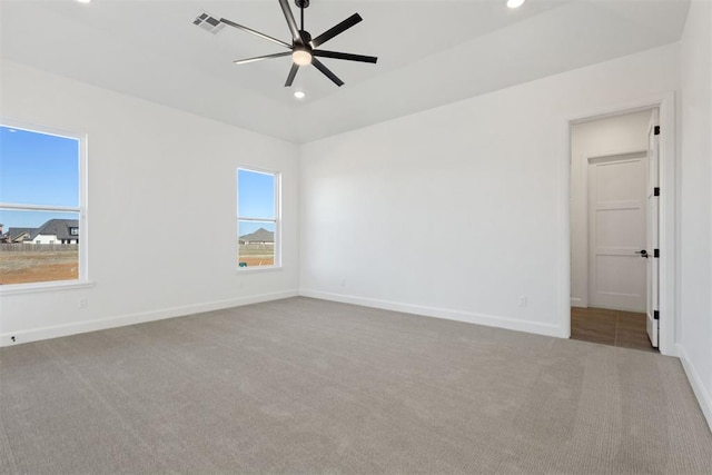 spare room featuring recessed lighting, visible vents, baseboards, and carpet