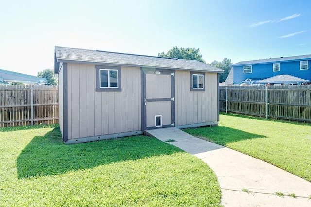 view of outdoor structure with a yard