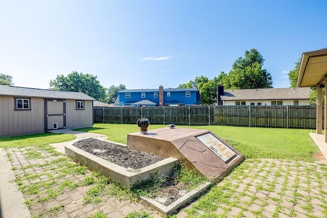 view of storm shelter with an outdoor structure and a lawn