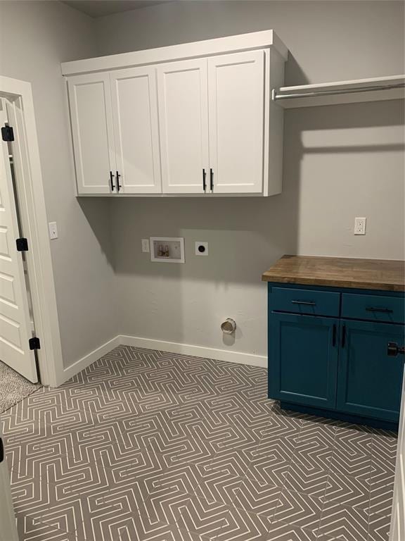 washroom featuring washer hookup, hookup for an electric dryer, and cabinets