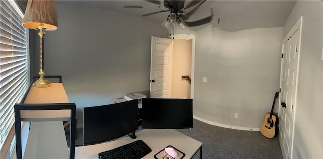 carpeted office featuring ceiling fan