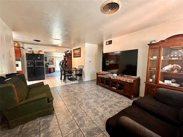 living room featuring tile patterned flooring