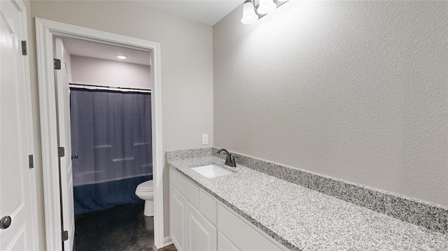 full bathroom featuring shower / tub combo, vanity, and toilet