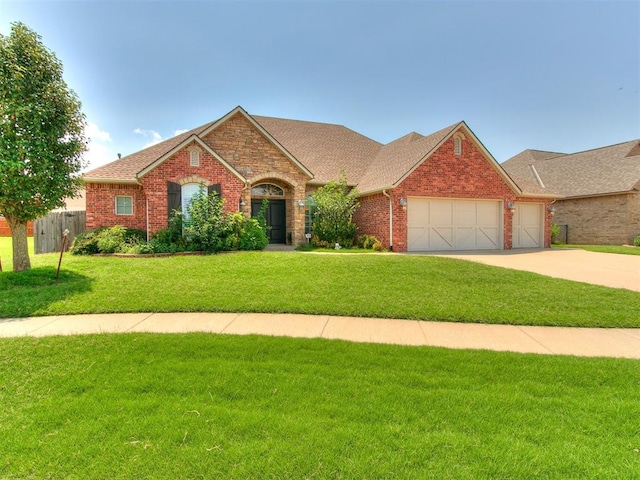 ranch-style home featuring a front yard and a garage