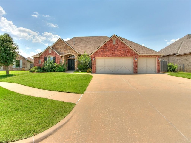 view of front of home with a front lawn and a garage