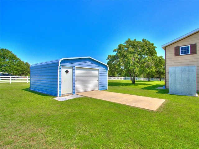 garage featuring a lawn